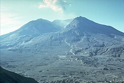 Mount St. Helens in September 1980 approximately four months after the eruption, photographed from roughly the same location as the earlier picture. Note the barrenness of the terrain as compared to the image above.