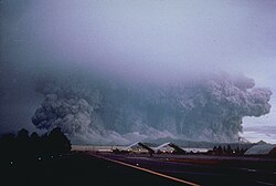 View to the west from Clark Air Base of the major eruption of Pinatubo on June 15, 1991. The June 15–16 climatic phase lasted more than fifteen hours, sent tephra about 35 km (22 mi) into the atmosphere, generated voluminous pyroclastic flows, and left a caldera in the former summit region. Later dubbed Black Saturday, the day of darkness stretched for 36 hours.