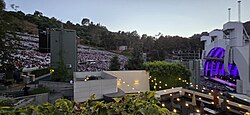 The view of the Hollywood Bowl and its band shell during a performance in 2024. The Backyard, one of the Hollywood Bowl's two restaurants, is in the foreground.