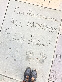 Garland's signature, handprints, and footprints in the concrete in front of Grauman's Chinese Theatre in Los Angeles