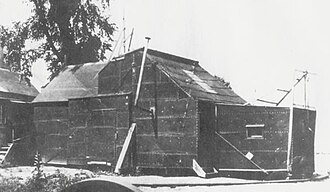 Construction of the imposing Black Maria began in December 1892. To take full advantage of sunlight, the tar paper–lined studio was equipped with a hinged, flip-up roof and the entire structure could rotate on a track. "It obeys no architectural rules," declared Dickson, who found it "productive of the happiest effects in the films."[39]