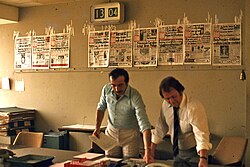 Editors work on producing an issue of Bild, West Berlin, 1977. Previous front pages are affixed to the wall behind them.