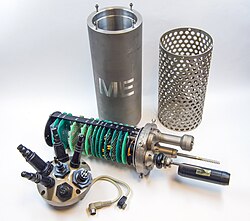 Disassembled CTD device, showing pressure housing, sensor cage, connectors, and internal electronics with sensors for conductivity, temperature, and pressure