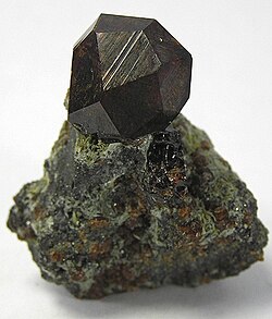 Black andradite, an end-member of the orthosilicate garnet group.