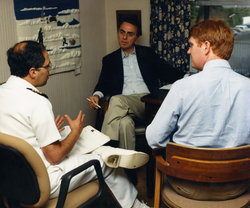Sagan (center) speaks with CDC employees in 1988