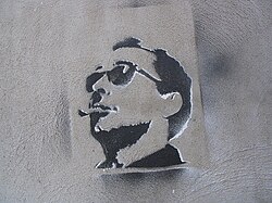 A stencil depicting Godard on a wall in Montreal.