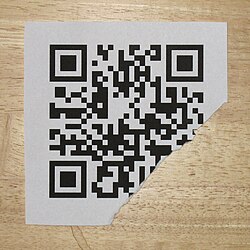 Damaged but still decodable QR code, link to en.m.wikipedia.org