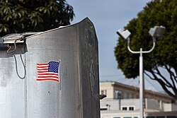 Truck with sticker showing the flag as if moving forward with the truck