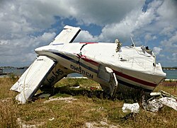 The wrecked tail section of N380MQ
