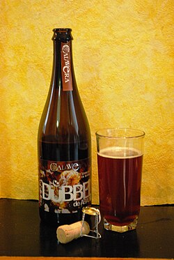 Calavera brand beer with served portion and the cork from the bottle.