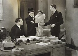 George MacQuarrie, Robinson, Claudette Colbert, and David Newell in The Hole in the Wall (1929), Robinson's first sound film.