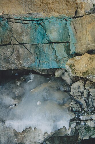 Rock face and downstream exit of the stream (Unnamed) of the cave of the Trou du Diable, Saint-Casimir, Quebec