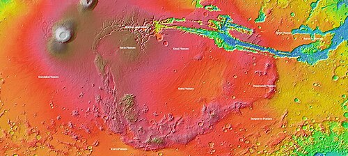 MOLA topography of the Thaumasia Plateau (Syria-Thaumasia block) and southern Tharsis. The volcano shown at the left is Arsia Mons. Valles Marineris extends across the northern edge. The areas in brown have the highest elevations on the Tharsis Plateau and may be considered the "summit region" of the Tharsis bulge.