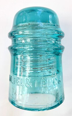 Pin-type glass insulator for long-distance open-wire transmission for telephone communication