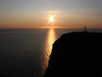 Midnight sun at the North Cape on the island of Magerøya in Norway