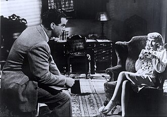 Femme fatale Phyllis Dietrichson, played by Barbara Stanwyck, in the classic film noir Double Indemnity