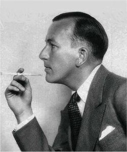 The Coward image: with cigarette holder in 1930