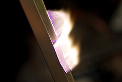 Artificial plasma produced in air by a Jacob's Ladder. The extremely strong potential difference between the two rods ionize particles in the air, creating a plasma.