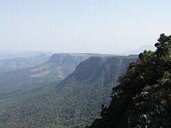 Part of the Great Escarpment in the Drakensberg, southern Africa. This landscape, with its high altitude plateau being incised into by the steep slopes of the escarpment, was cited by Davis as a classic example of his cycle of erosion.[33]