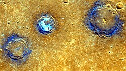 Enhanced-color image of craters Munch (left), Sander (center), and Poe (right) amid volcanic plains (orange) near Caloris Basin