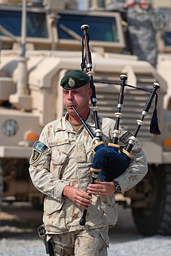 A Canadian bagpiper playing "Amazing Grace" during a memorial service, 29 October 2009, at Forward Operating Base Wilson, Afghanistan