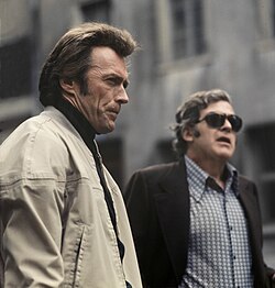 With an unidentified colleague at a film shoot for The Eiger Sanction, 1974