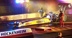 This Top Fuel dragster can accelerate from zero to 160 kilometres per hour (99 mph) in 0.86 seconds. This is a horizontal acceleration of 5.3 g. Combining this with the vertical g-force in the stationary case using the Pythagorean theorem yields a g-force of 5.4 g.
