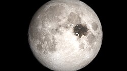 The Moon with Mare Tranquillitatis highlighted and the first crewed lunar landing marked