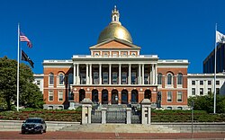 The Massachusetts State House is topped with a golden dome, and faces Boston Common on Beacon Hill.