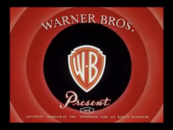 The "Warner Bros. Present[s]" title card from the first wave of color cartoons in the "Looney Tunes" series of cartoon shorts, from October 1942 until May 1947.