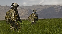 U.S. Army Special Forces soldiers from the 3rd Special Forces Group patrolling a field in the Gulistan district of Farah, Afghanistan
