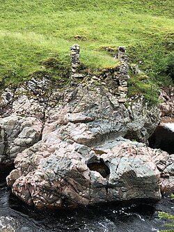 Hutton's Glen Tilt exposure at collapsed Dail-an-eas Bridge upstream from Forest Lodge, drawn by John Clerk of Eldin in 1785. The bridge collapsed in approximately 1973. Location: 56°51′04″N 3°44′31″W﻿ / ﻿56.851082°N 3.741822°W﻿ / 56.851082; -3.741822﻿ (Dail-an-eas bridge)