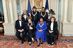 U.S. Secretary of State John Kerry and Teresa Heinz with 2013 Kennedy Center honorees: Shirley MacLaine, Martina Arroyo, Billy Joel, Carlos Santana, and Herbie Hancock in 2013.