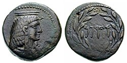 Cossura bronze coin showing a portrait of Isis with Punic legend