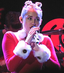 Cyrus performing at the 2013 Jingle Ball in Tampa, Florida