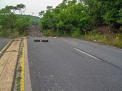 A berm blocks entry to the abandoned section of Route 61