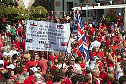 Thousands of Gibraltarians dress in their national colours of red and white during the 2013 Gibraltar National Day celebrations. Gibraltarians were the only group of overseas territories residents who could apply for full British citizenship without restrictions before 2002.