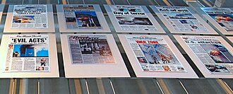 A panel in the Newseum in Washington, D.C., showing newspaper headlines from the day after 9/11