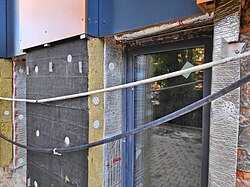Thermal insulation retrofit works on a department store building in Poland