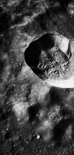 Oblique view of Proclus from Apollo 17, showing interior detail. The arrow points to a boulder that is about 200 m across.