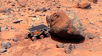 Sojourner takes its Alpha Particle X-ray Spectrometer measurement of the Yogi Rock.