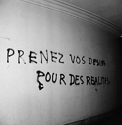 A graffiti telling students to "take your desires for reality" at the Sorbonne, May 1968