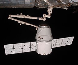 The COTS 2 Dragon is berthed to the International Space Station (ISS) by Canadarm2