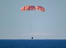 Integrity about to splashdown in the Pacific Ocean