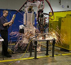 Sparks from spot welding robot