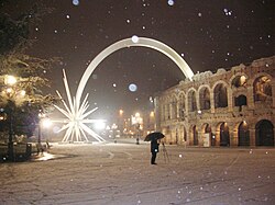Christmas lights at Verona Arena in 2006[9] Christmas in Italy (in Italian: Natale) begins on 8 December, with the feast of the Immaculate Conception, the day on which traditionally the Christmas tree is mounted and ends on 6 January, of the following year with the Epiphany (in Italian: Epifania).[10]