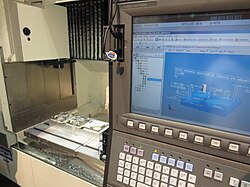 STEP-NC machining on an Okuma CNC at IMTS 2014.