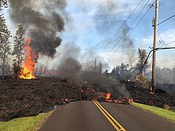 Lava from a fissure slowly advanced to the northeast on Hoʻokupu Street in Leilani Estates subdivision (May 5, 2018)