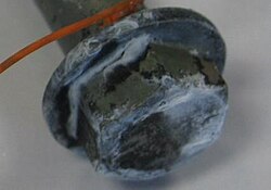 Electroplated and yellow chromated bolt with white corrosion