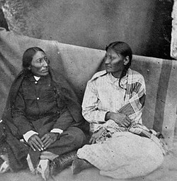 Mochi (right), a Southern Cheyenne in Black Kettle's camp, became a warrior after her experiences at the Sand Creek massacre; photographed circa 1875.